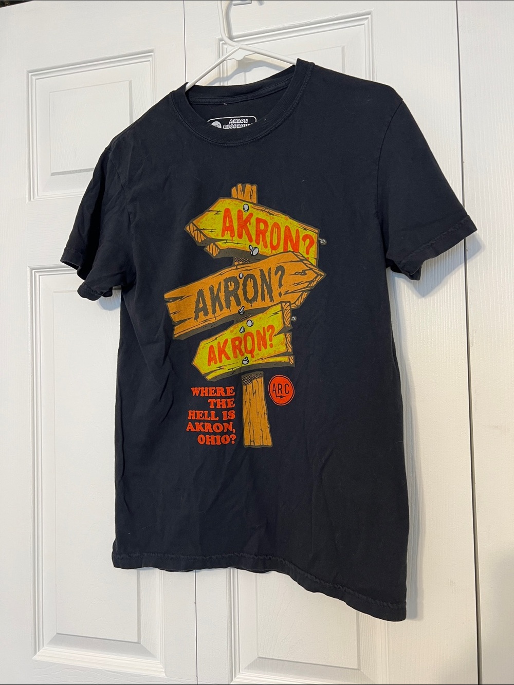 Black Akron Graphic Tee with Yellow + Orange Sign Print
